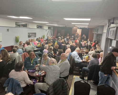 Packed out room of quiz teams at their tables