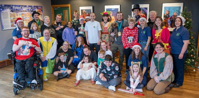 PAG helpers, children and Panto Stars pose for a group photo